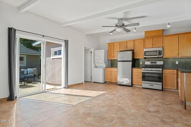 a view of a kitchen with a sink and dishwasher cabinets
