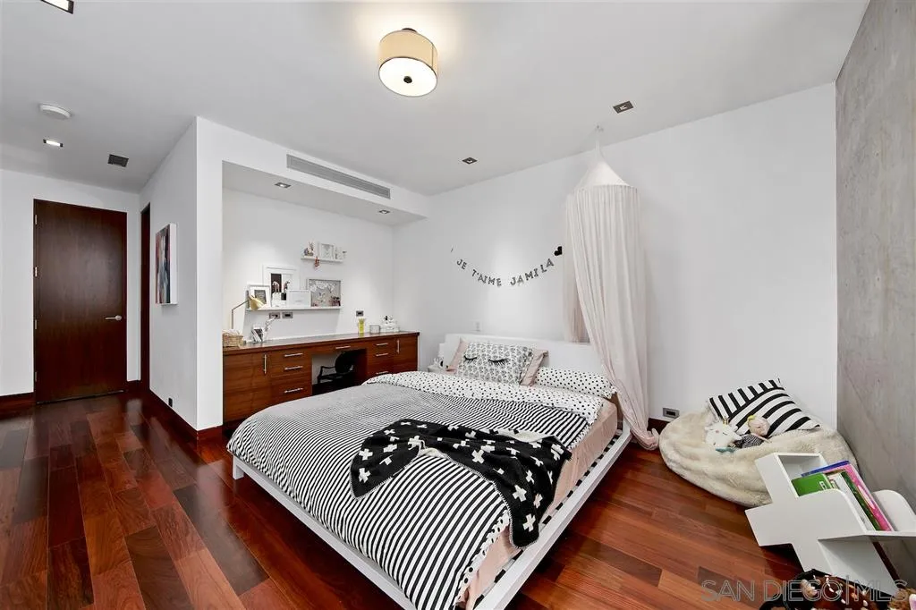 116 Nob Avenue Del Mar, CA 92014 - Photo 16 of 25 a bedroom with a bed and wooden floor