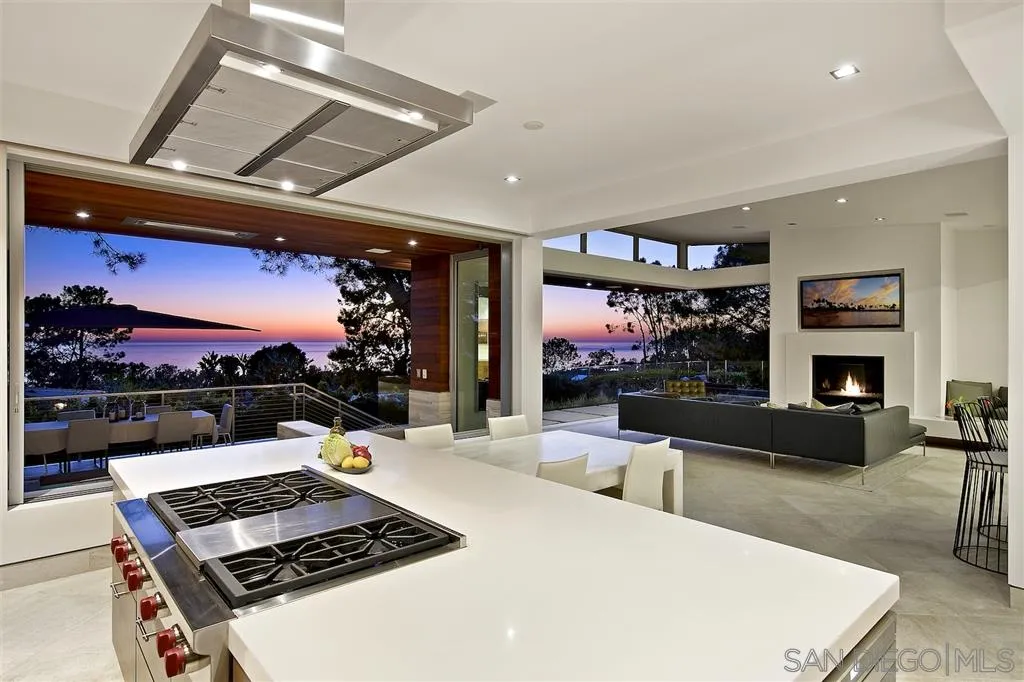 116 Nob Avenue Del Mar, CA 92014 - Photo 2 of 25 a living room with furniture a flat screen tv and a floor to ceiling window