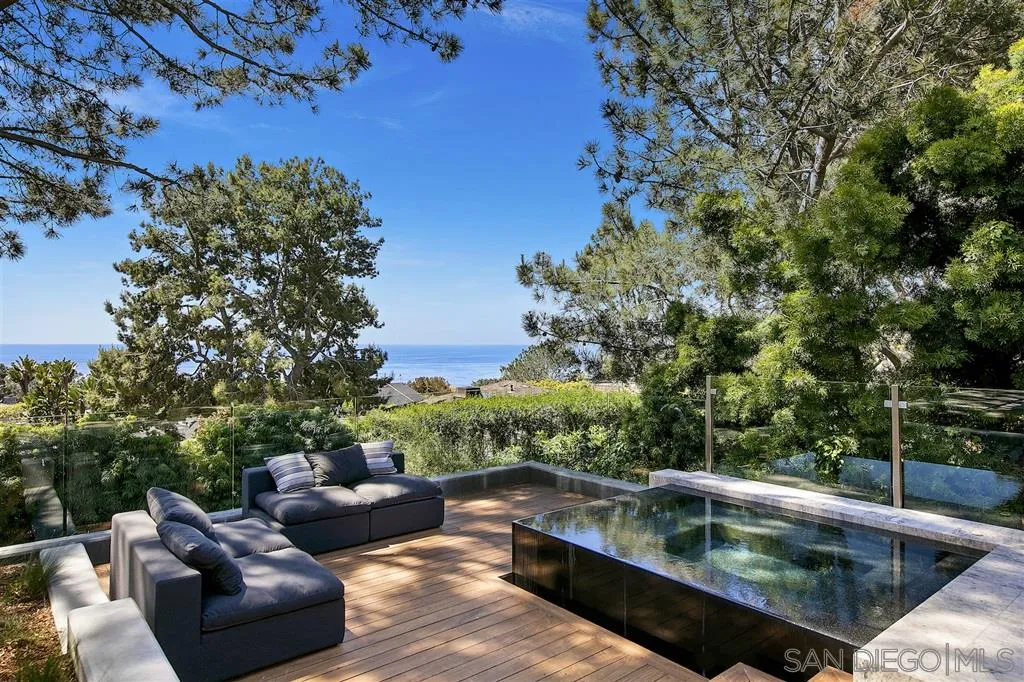 116 Nob Avenue Del Mar, CA 92014 - Photo 21 of 25 a view of a swimming pool with couches and wooden fence