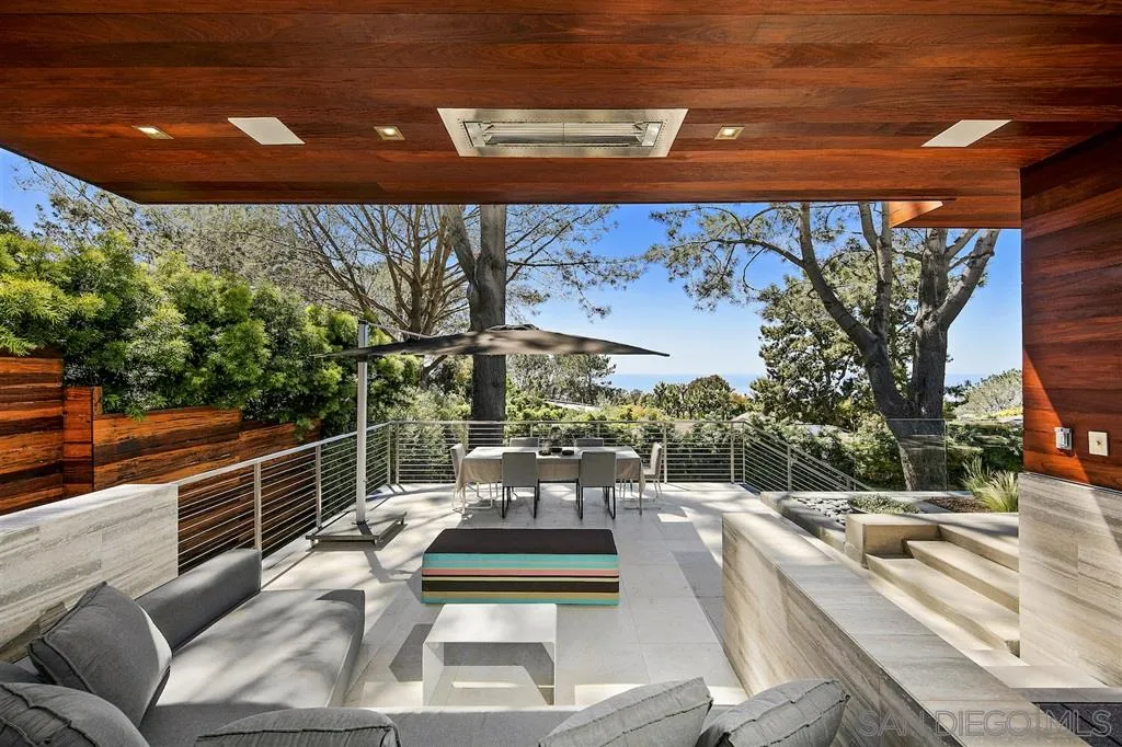 116 Nob Avenue Del Mar, CA 92014 - Photo 24 of 25 a view of a patio with couches table and chairs with wooden floor