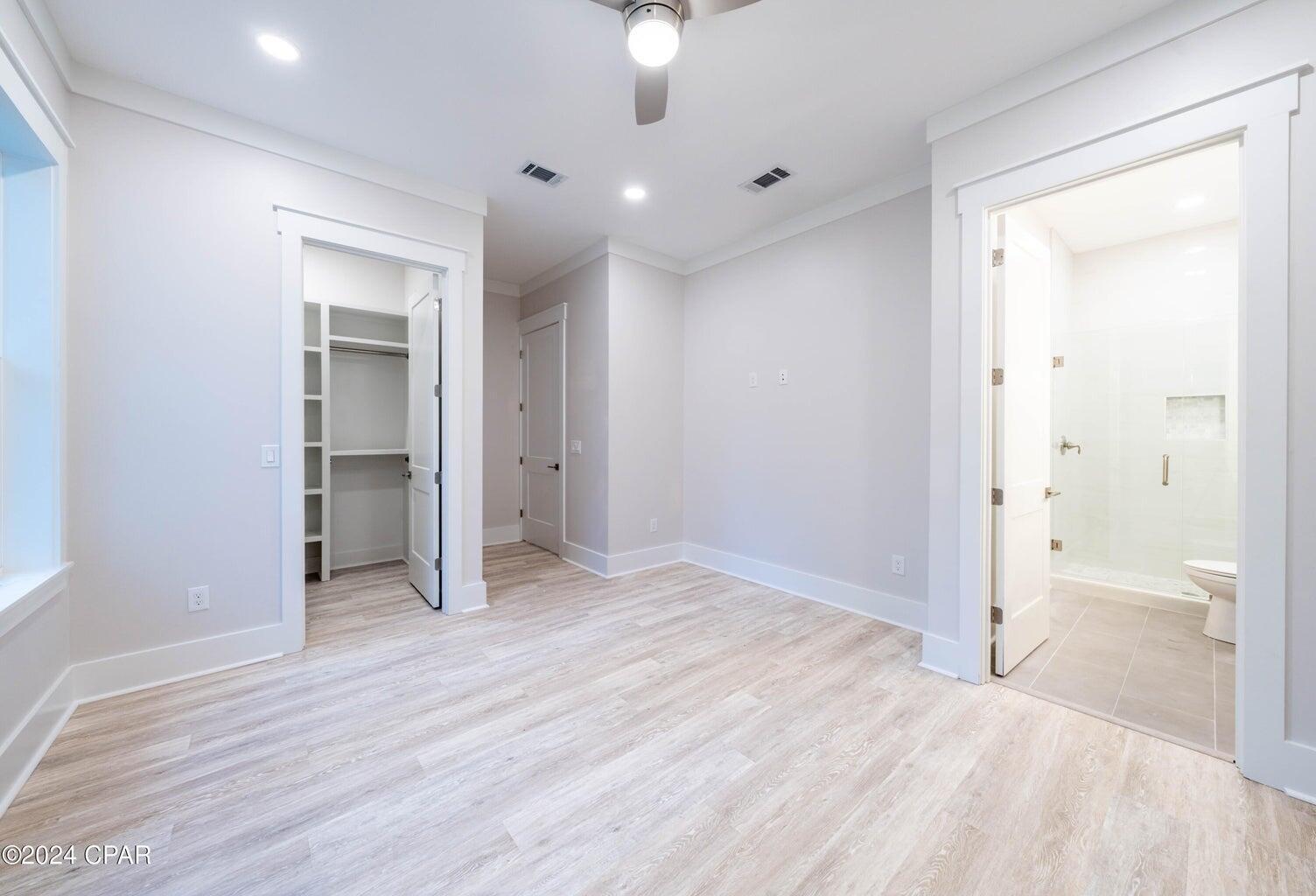 142 7th Street Santa Rosa Beach, FL 32459 - Photo 16 of 22 a view of empty room with wooden floor