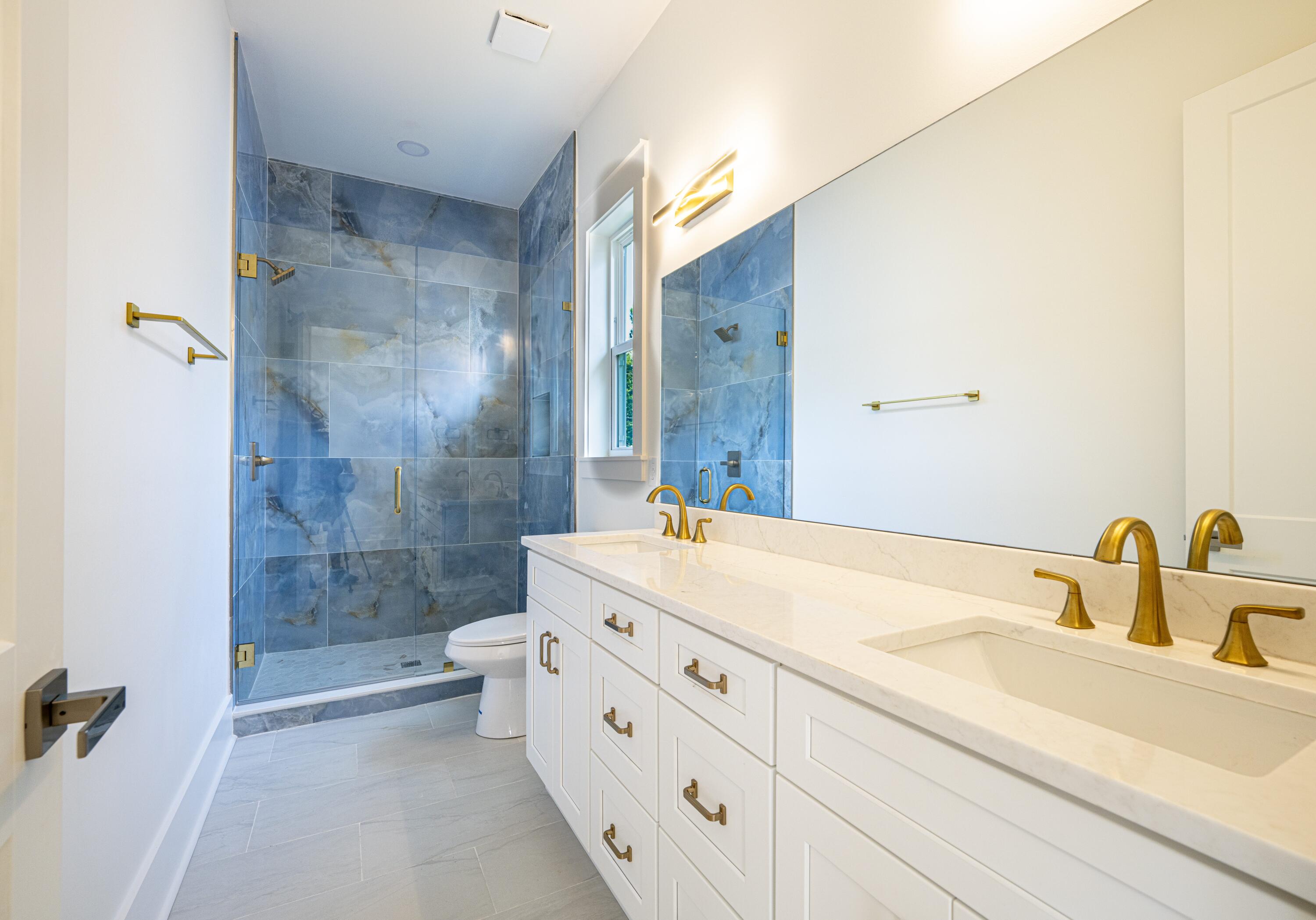 142 7th Street Santa Rosa Beach, FL 32459 - Photo 22 of 22 a bathroom with a sink a toilet and shower