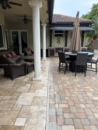 a view of outdoor dining space with a patio