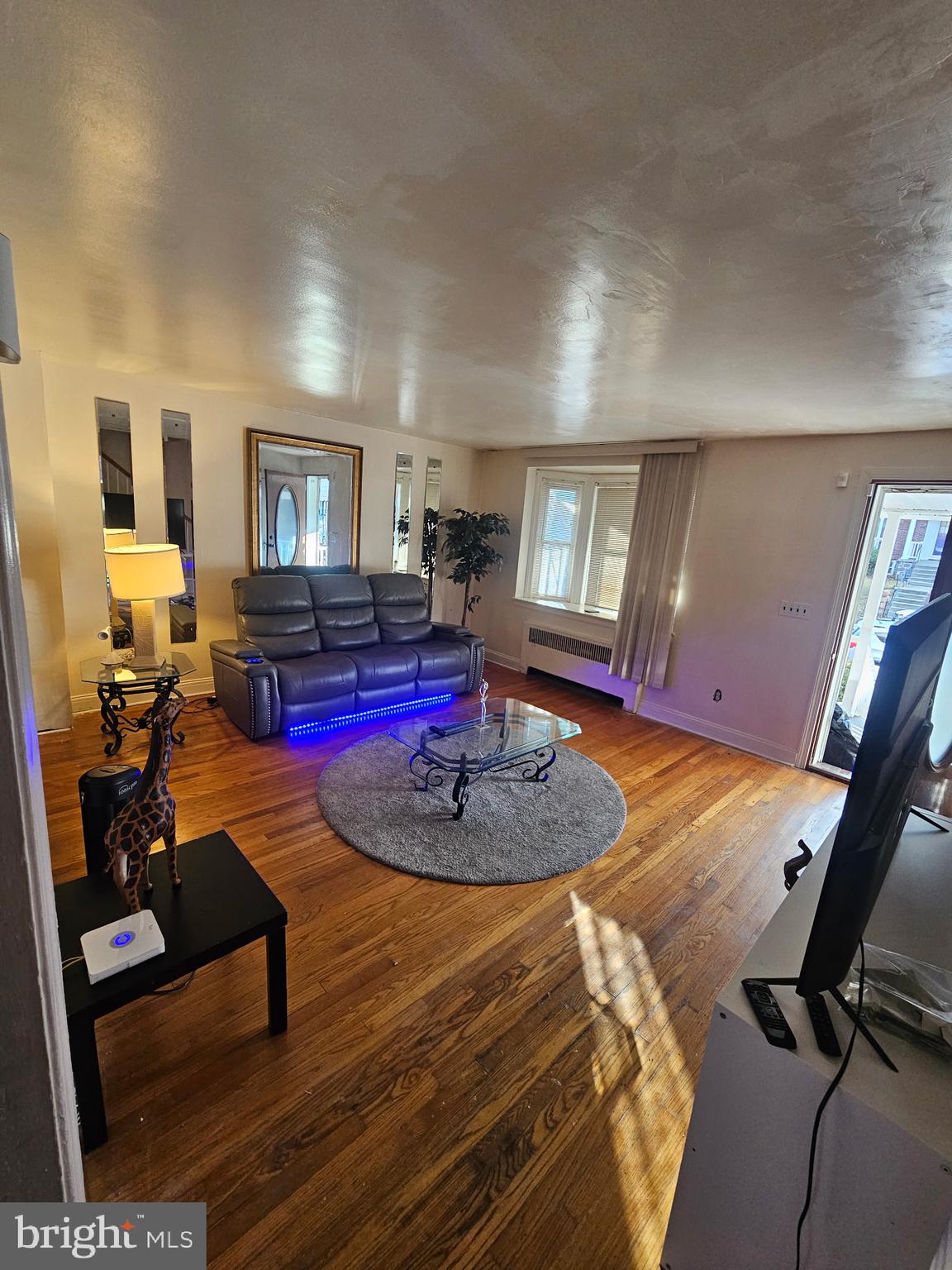 3915 Ednor Road Baltimore, MD 21218 - Photo 3 of 10 a living room with furniture and wooden floor