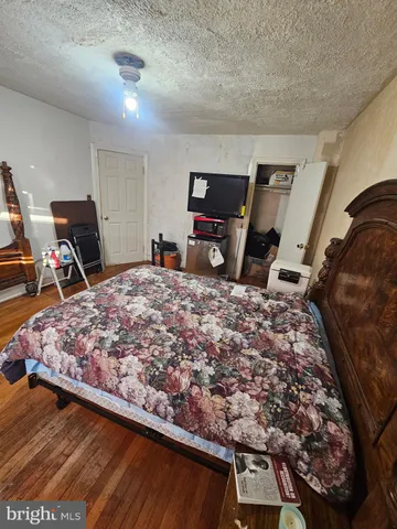 a bed sitting in a room next to a window
