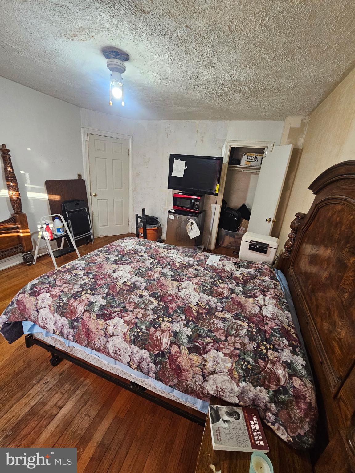 3915 Ednor Road Baltimore, MD 21218 - Photo 9 of 10 a bed sitting in a room next to a window