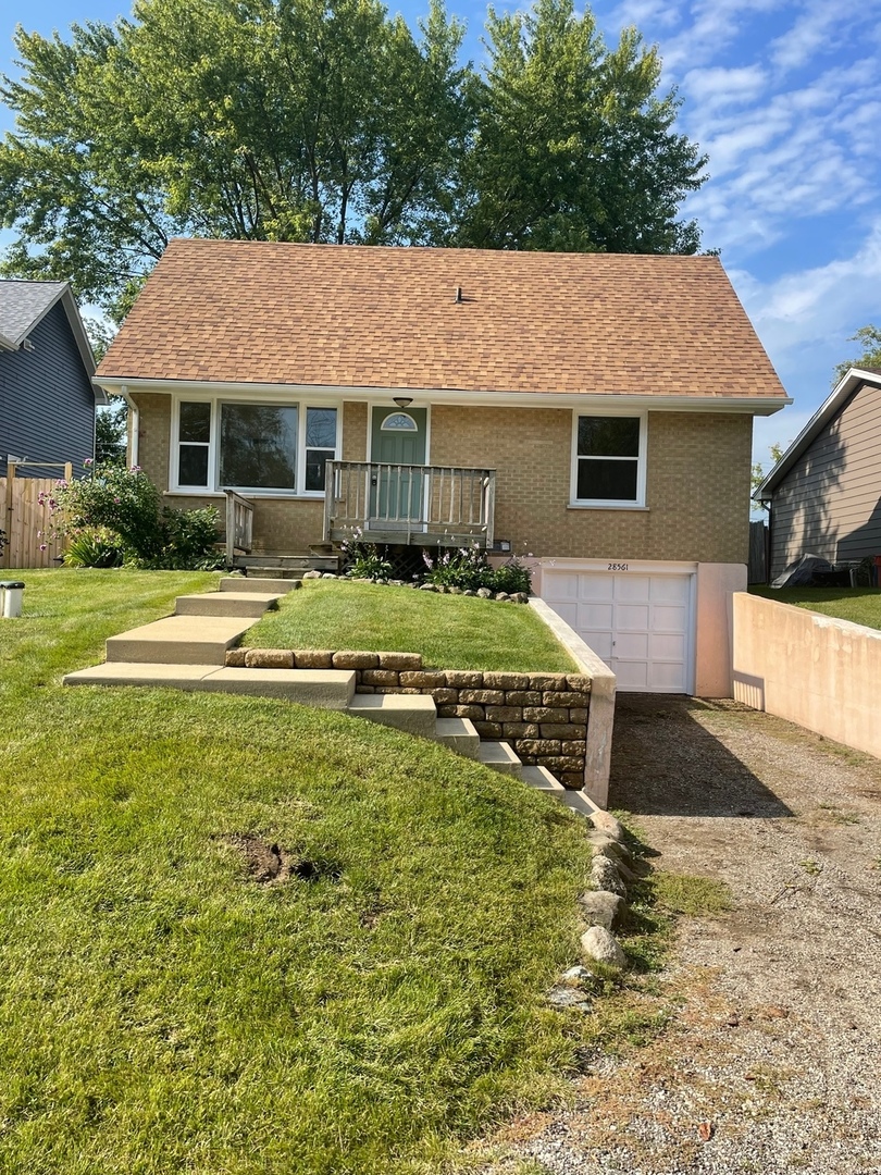 28561 West High Road Ingleside, IL 60041 - Photo 1 of 19 a front view of a house with a yard