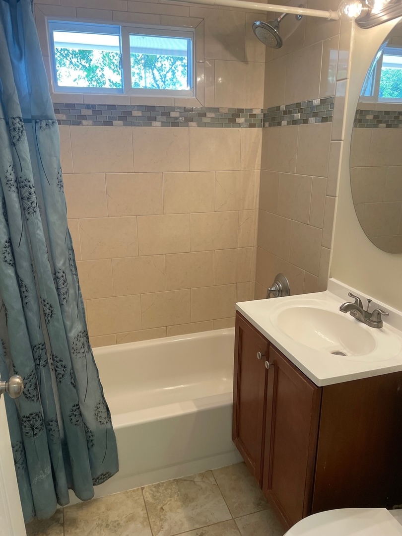 28561 West High Road Ingleside, IL 60041 - Photo 12 of 19 a bathroom with a sink and a mirror