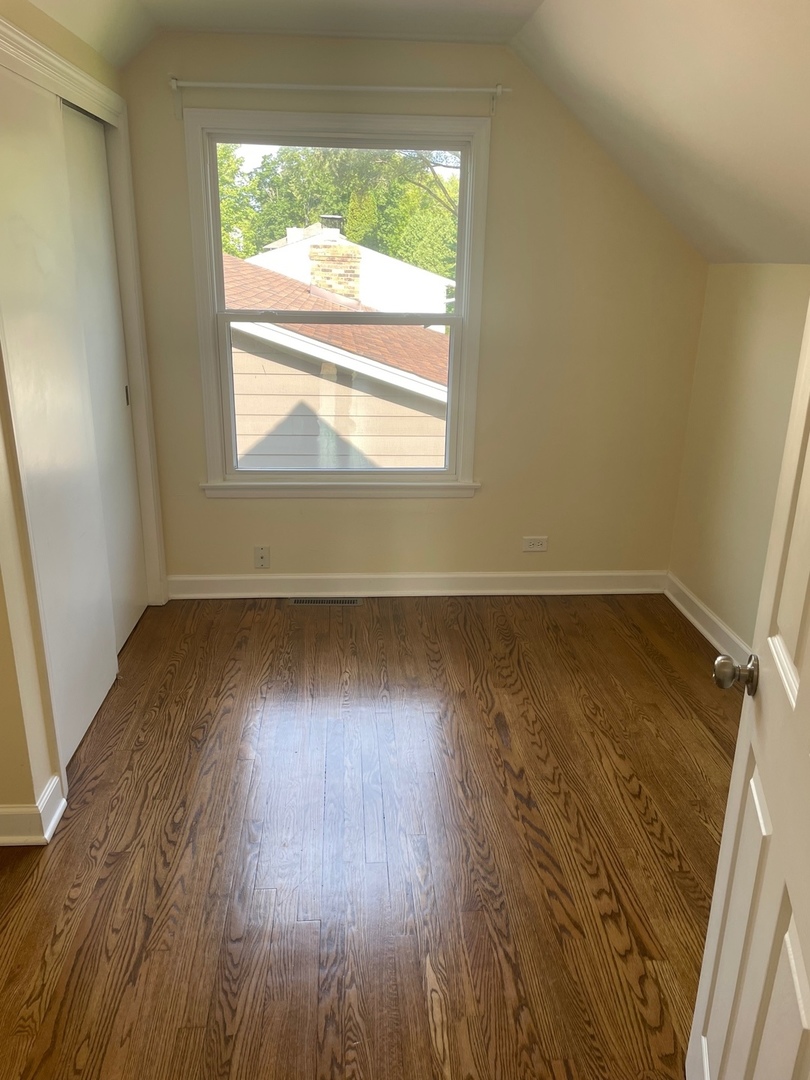 28561 West High Road Ingleside, IL 60041 - Photo 14 of 19 an empty room with wooden floor and windows