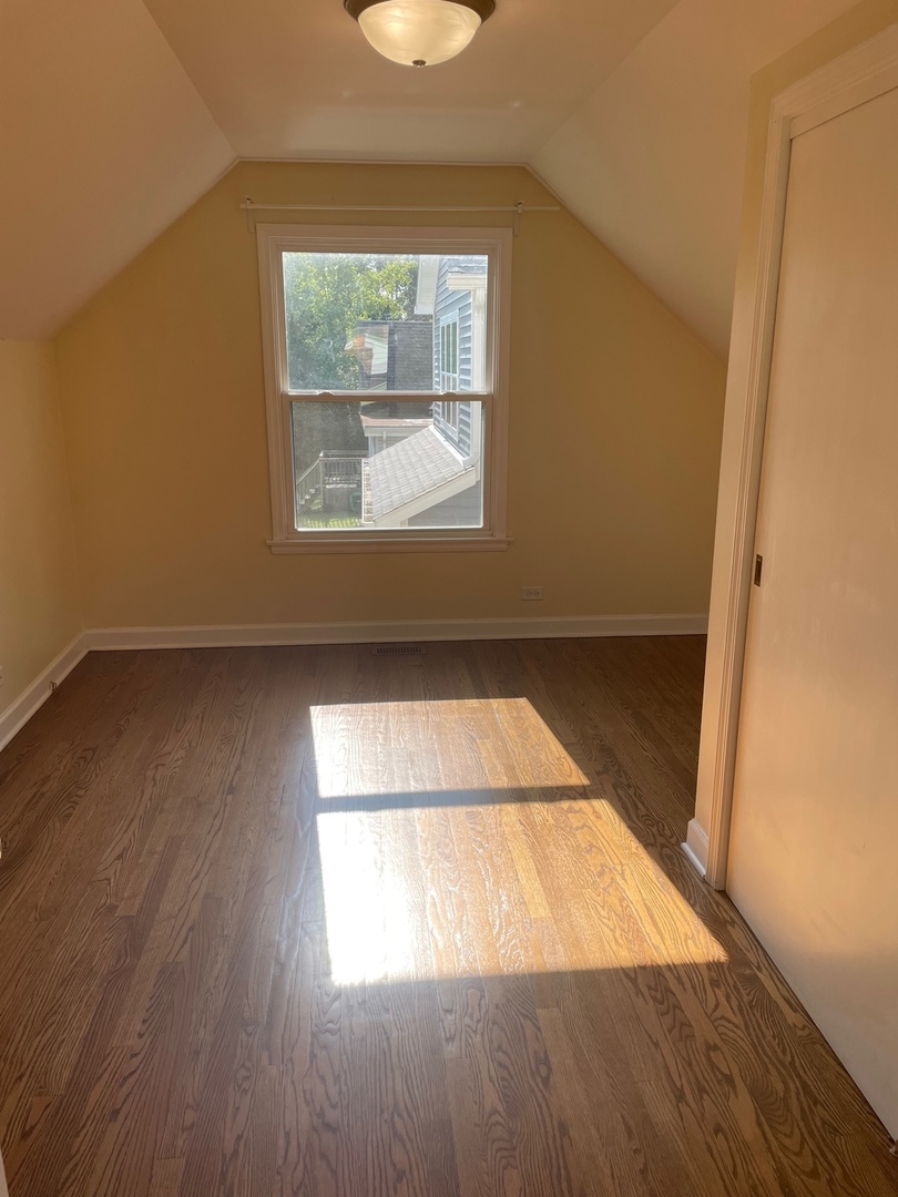 28561 West High Road Ingleside, IL 60041 - Photo 15 of 19 an empty room with wooden floor and windows