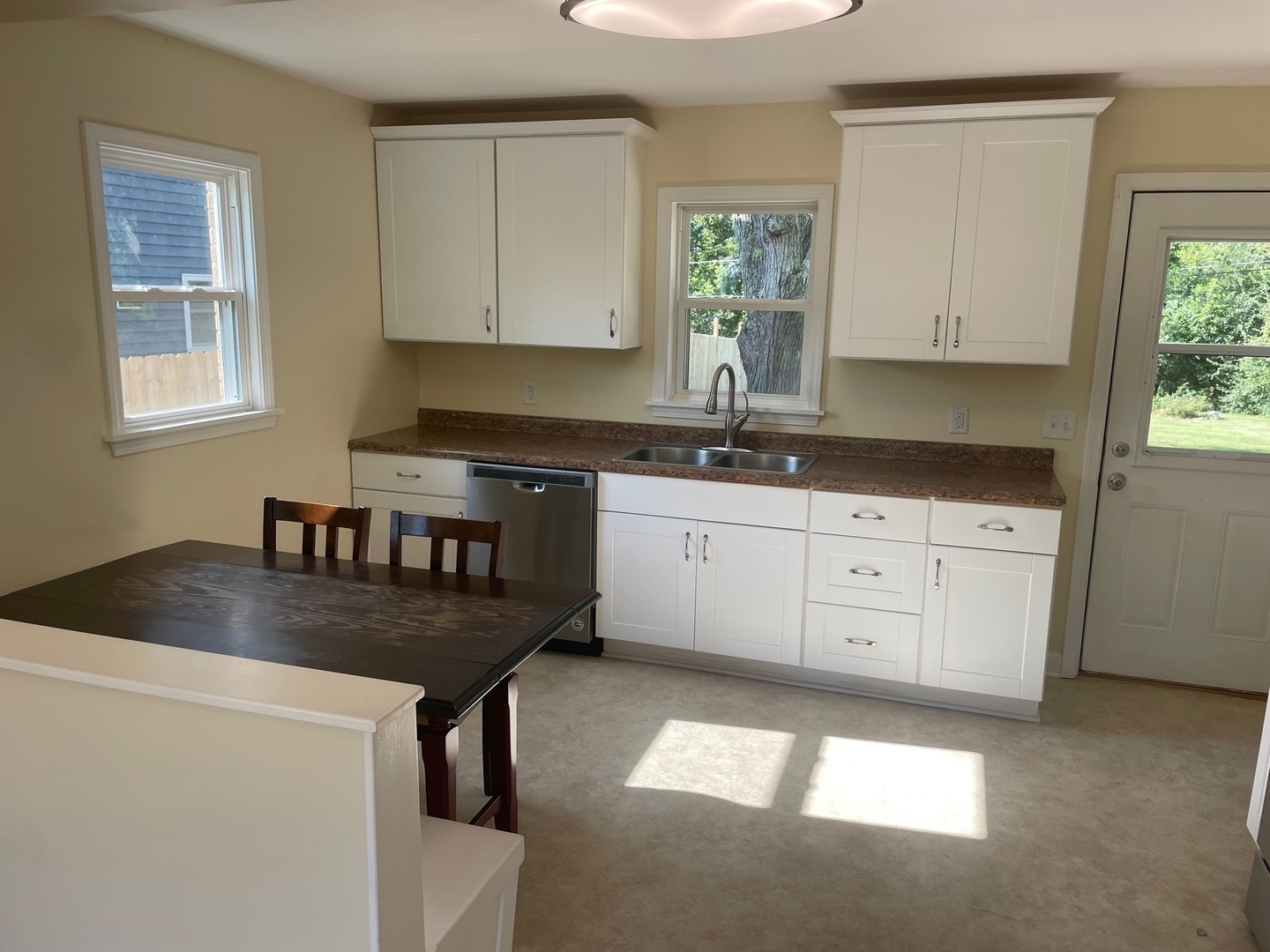28561 West High Road Ingleside, IL 60041 - Photo 6 of 19 a kitchen with granite countertop a sink a stove a window and cabinets
