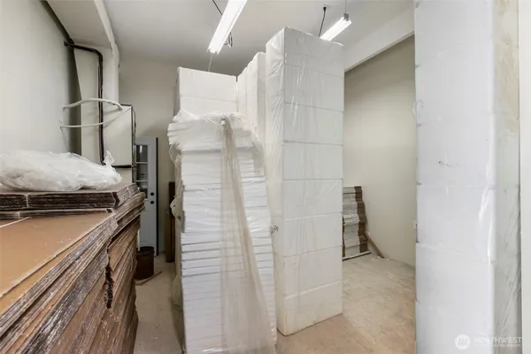 a kitchen with a refrigerator and a stove