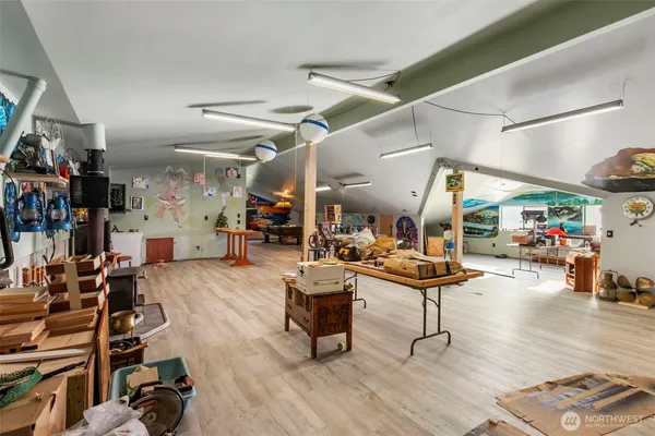 a view of a room with lots of wooden furniture