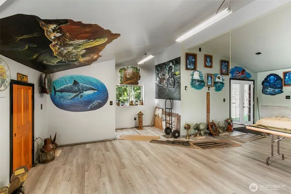 a room with gym equipment and view of living room