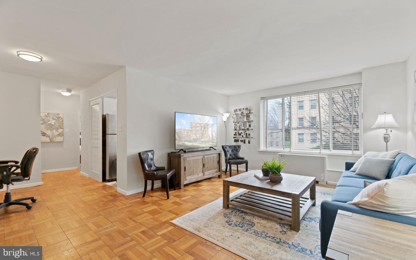 4100 W Street Northwest, Unit 410 Washington, DC 20007 - Photo 14 of 17 a living room with furniture and a table