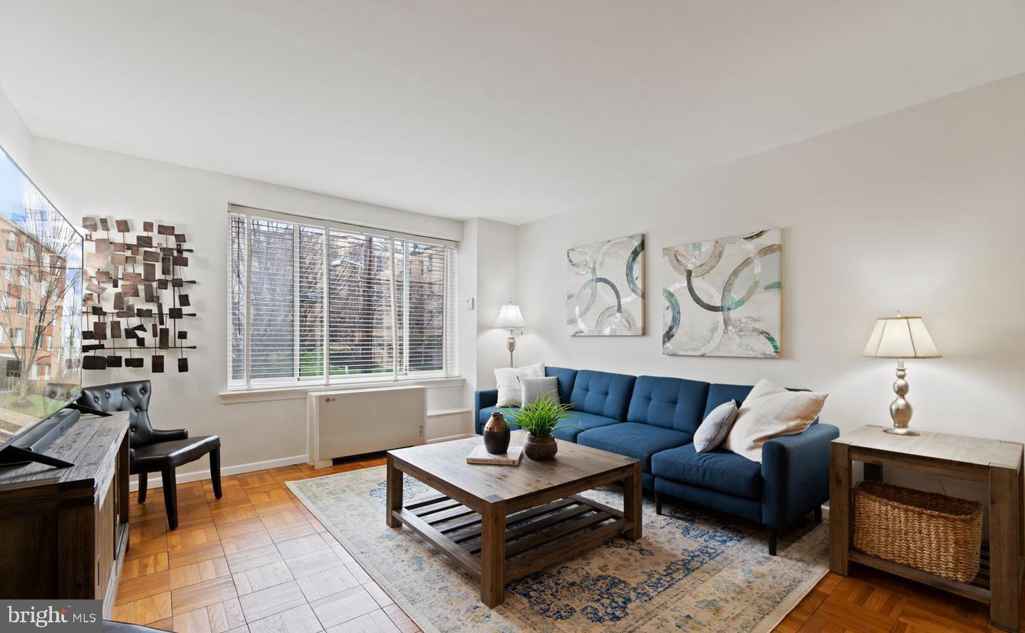 4100 W Street Northwest, Unit 410 Washington, DC 20007 - Photo 16 of 18 a living room with furniture and a window