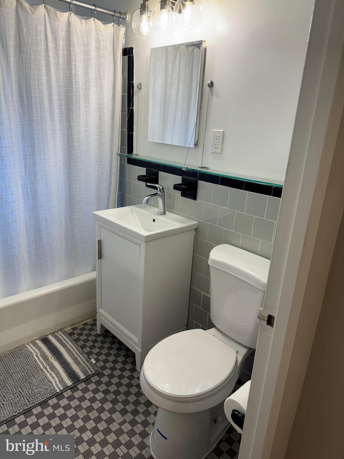 4100 W Street Northwest, Unit 410 Washington, DC 20007 - Photo 17 of 18 a bathroom with a sink and a toilet