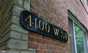 4100 W Street Northwest, Unit 410 Washington, DC 20007 - Photo 18 of 18 a street sign on a brick wall