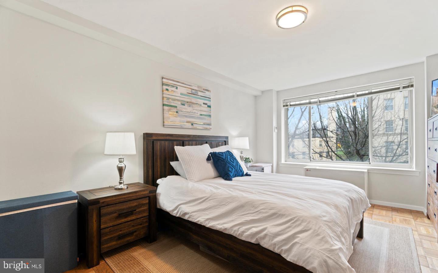 4100 W Street Northwest, Unit 410 Washington, DC 20007 - Photo 3 of 17 a bedroom with a bed and a large window