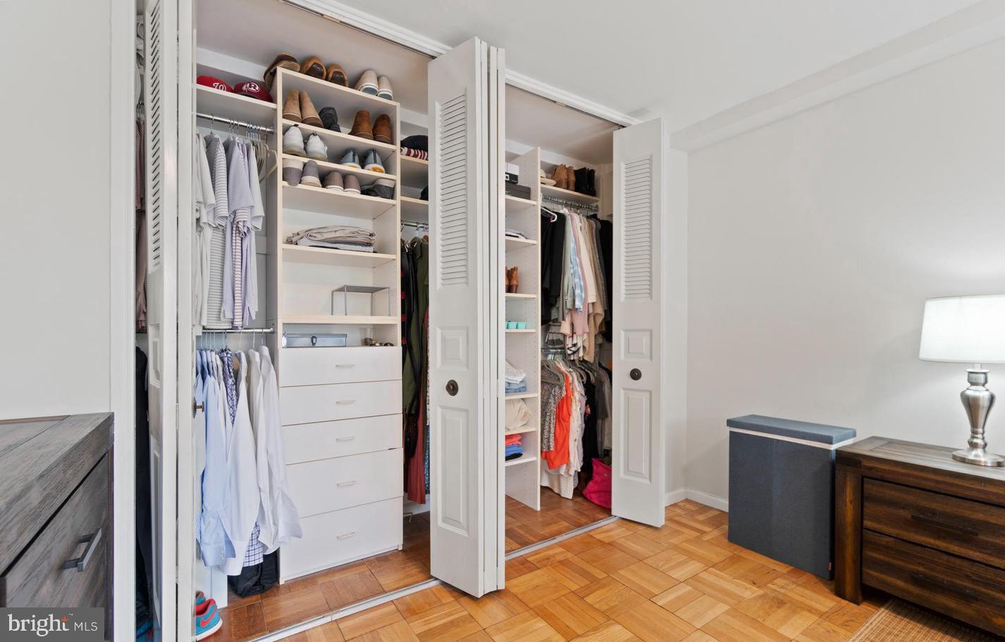 4100 W Street Northwest, Unit 410 Washington, DC 20007 - Photo 9 of 17 a view of walk in closet with clothes and shoes