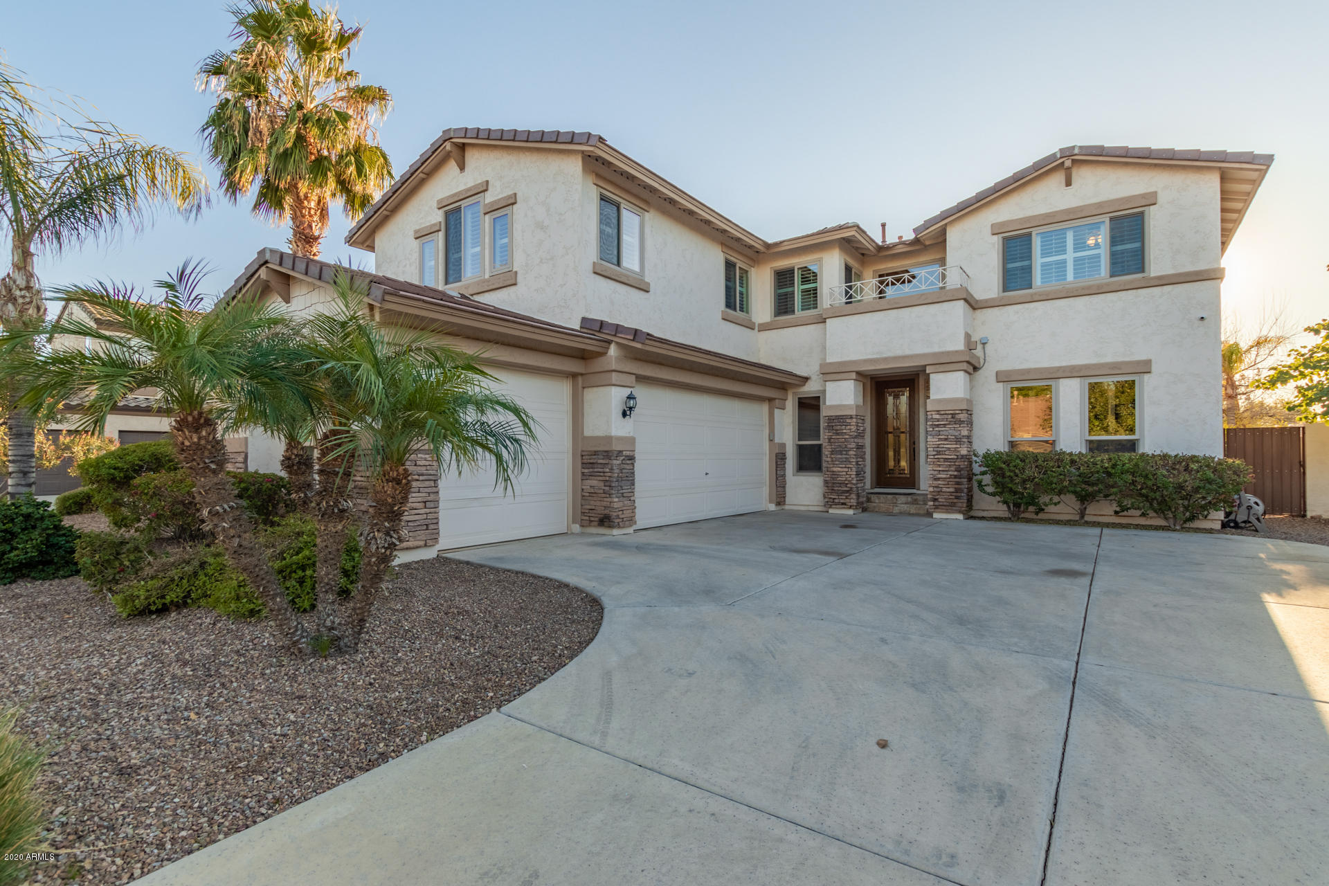 4549 East Ruffian Road Gilbert, AZ 85297 - Photo 1 of 52 a front view of a house with garden