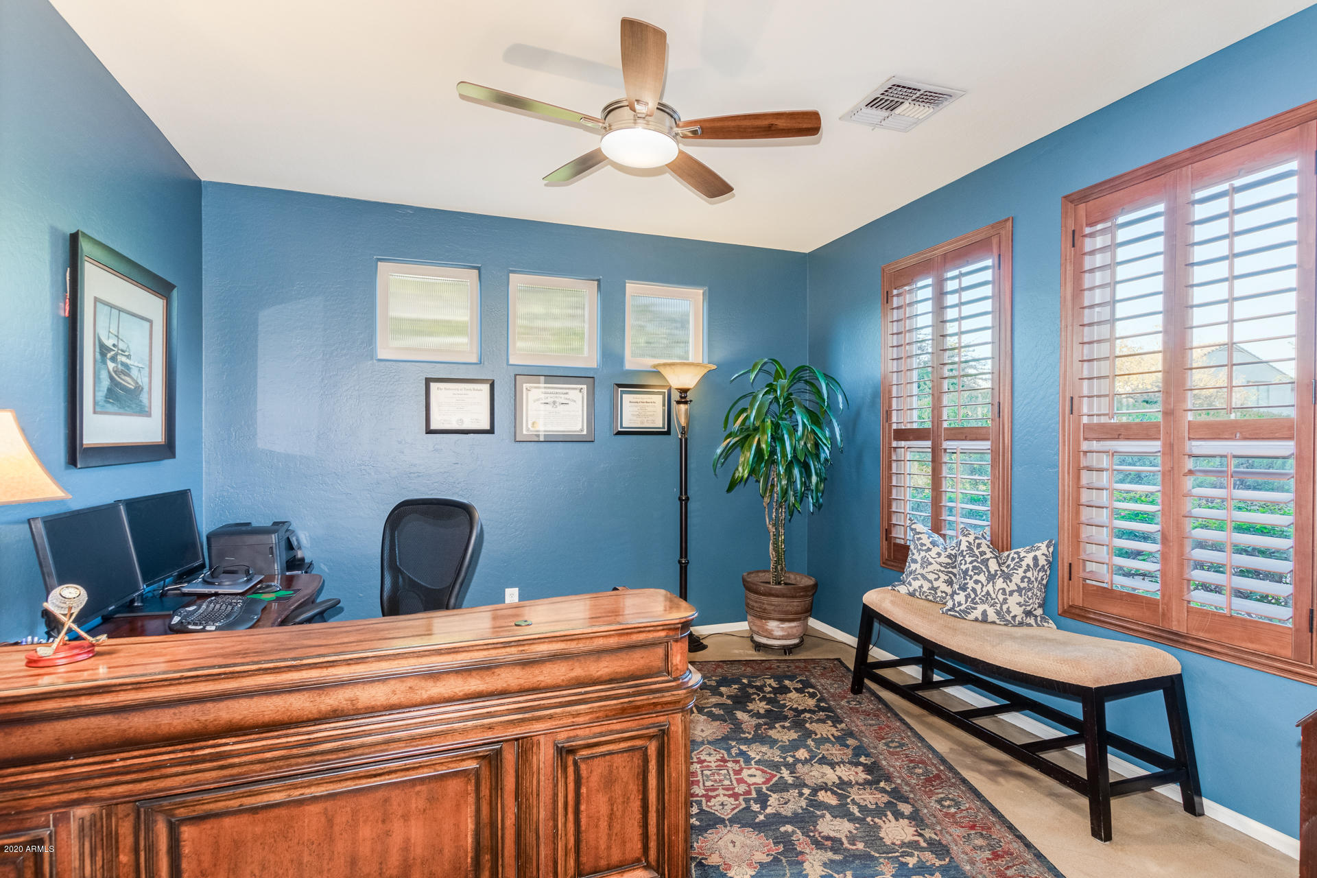 4549 East Ruffian Road Gilbert, AZ 85297 - Photo 11 of 52 a bedroom with furniture and a potted plant