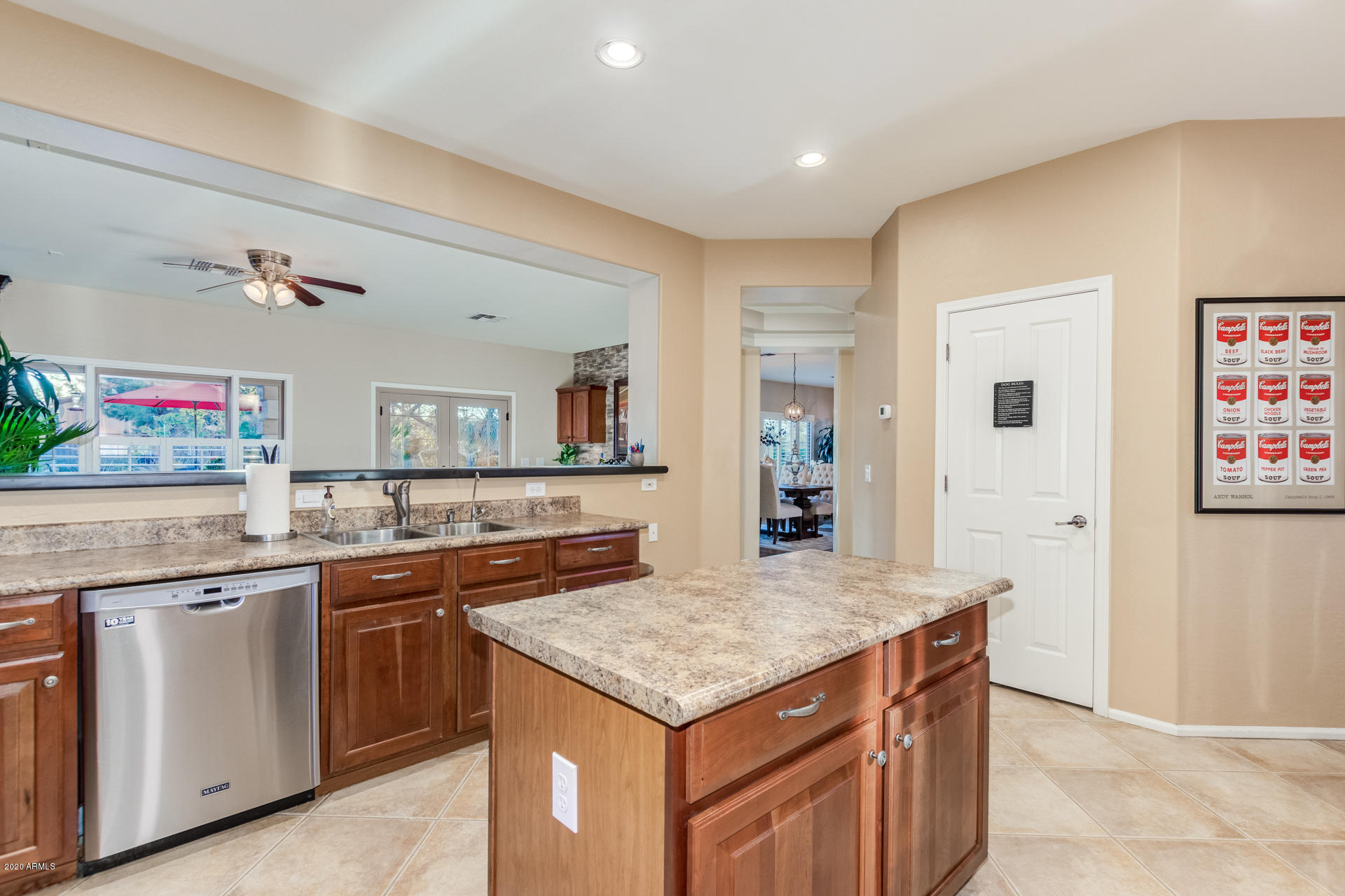 4549 East Ruffian Road Gilbert, AZ 85297 - Photo 14 of 52 a kitchen with a stove and a sink