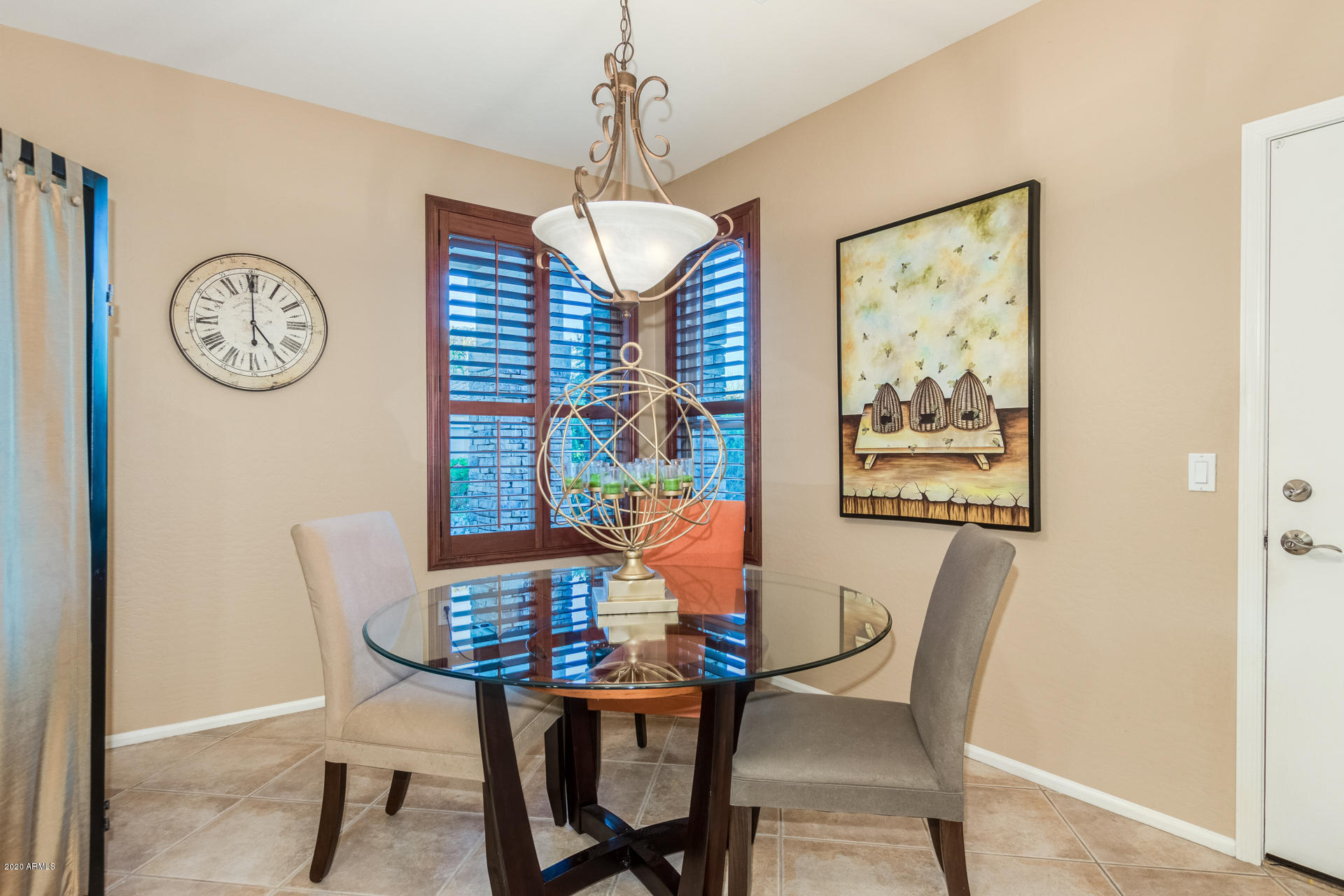 4549 East Ruffian Road Gilbert, AZ 85297 - Photo 16 of 52 a view of a dining room with furniture and a chandelier