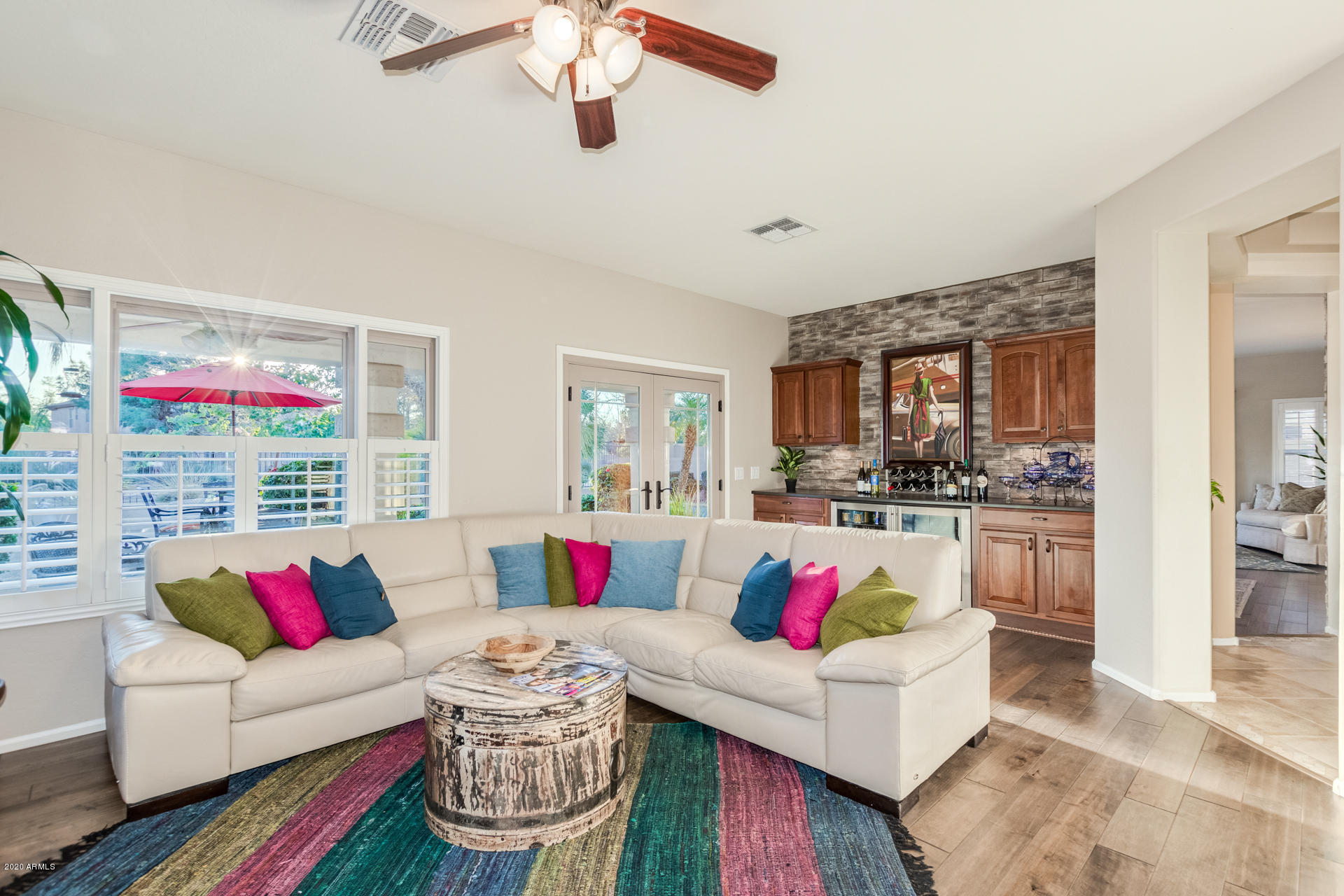 4549 East Ruffian Road Gilbert, AZ 85297 - Photo 18 of 52 a living room with furniture and a large window