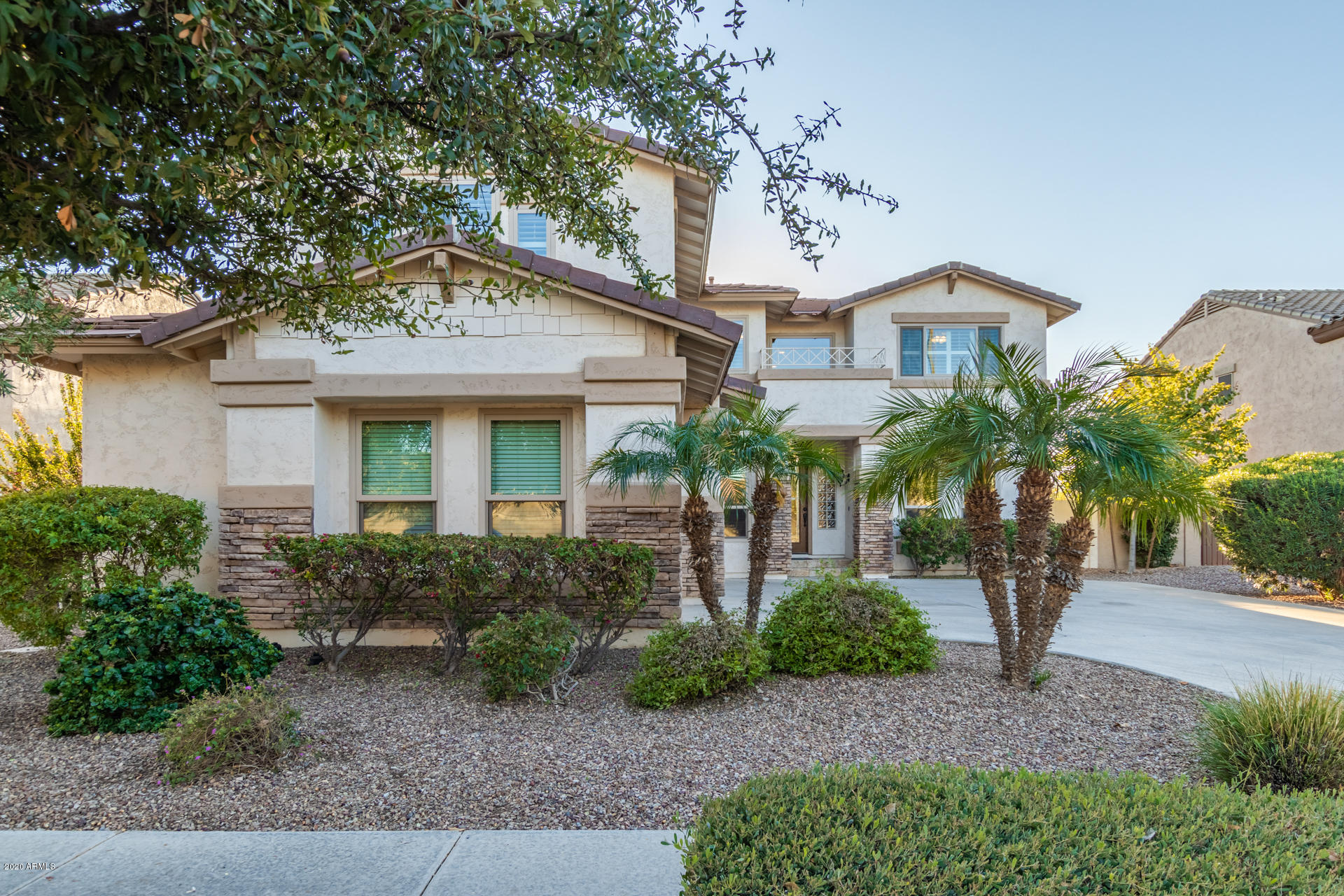 4549 East Ruffian Road Gilbert, AZ 85297 - Photo 2 of 52 a front view of a house with garden