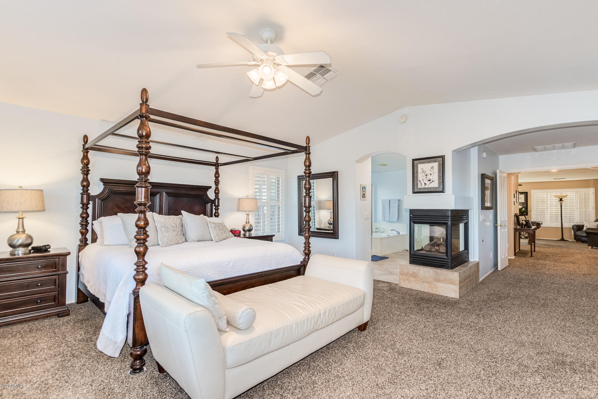 4549 East Ruffian Road Gilbert, AZ 85297 - Photo 31 of 52 a bed room with a bed and a chandelier