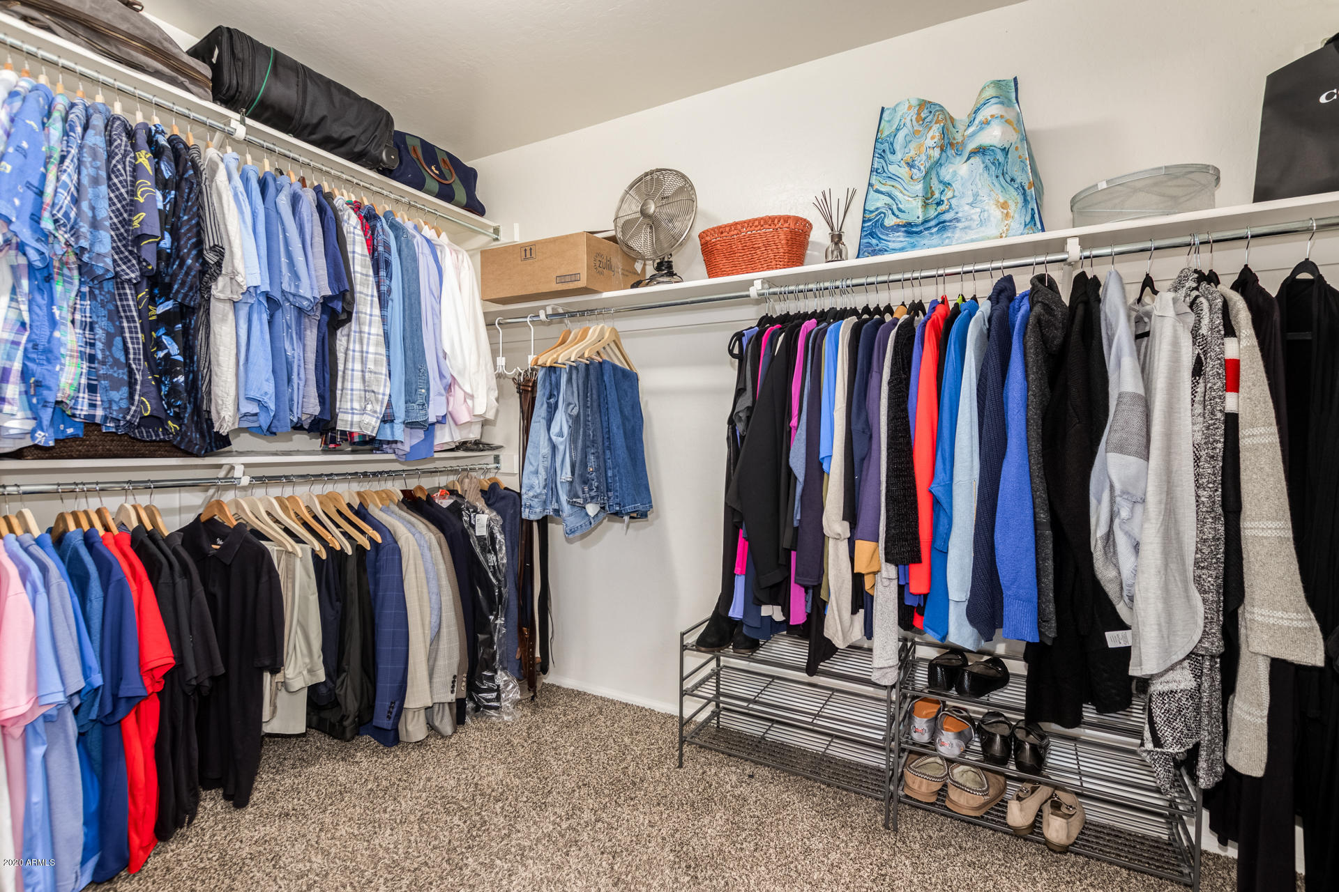 4549 East Ruffian Road Gilbert, AZ 85297 - Photo 35 of 52 a view of walk in closet with clothes