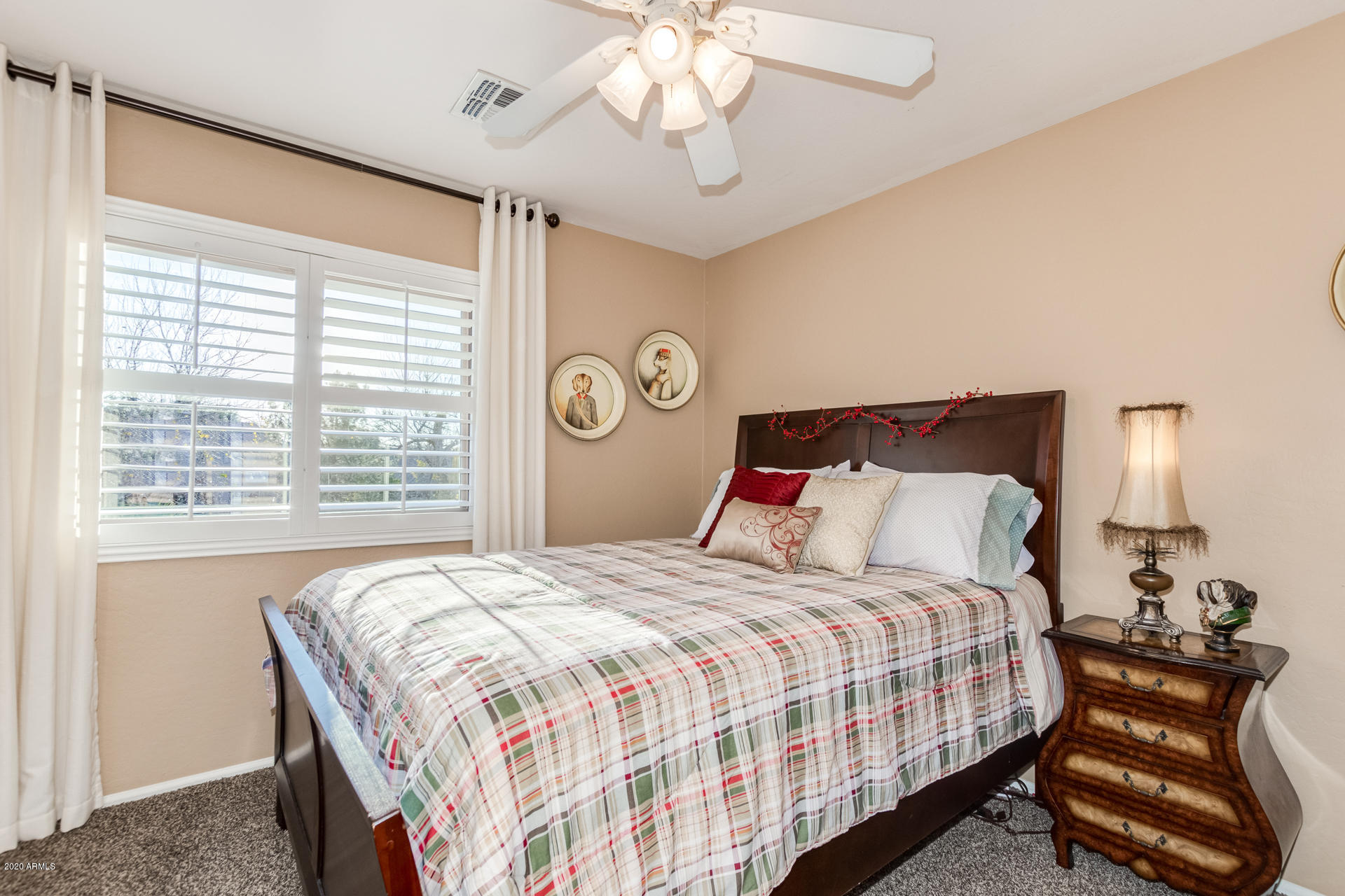 4549 East Ruffian Road Gilbert, AZ 85297 - Photo 39 of 52 a bedroom with a bed and a chandelier