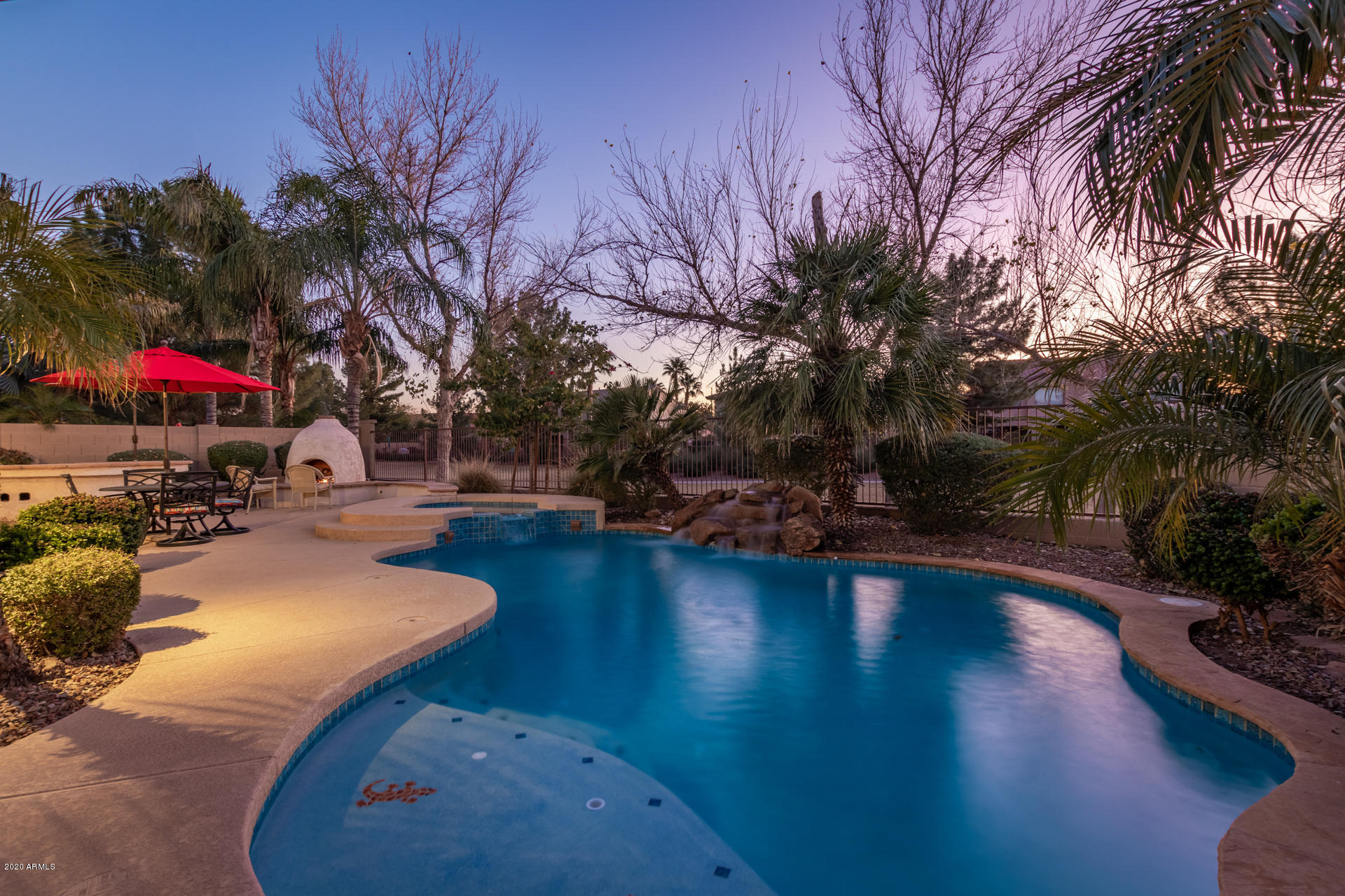4549 East Ruffian Road Gilbert, AZ 85297 - Photo 42 of 52 a view of outdoor space with swimming pool and seating