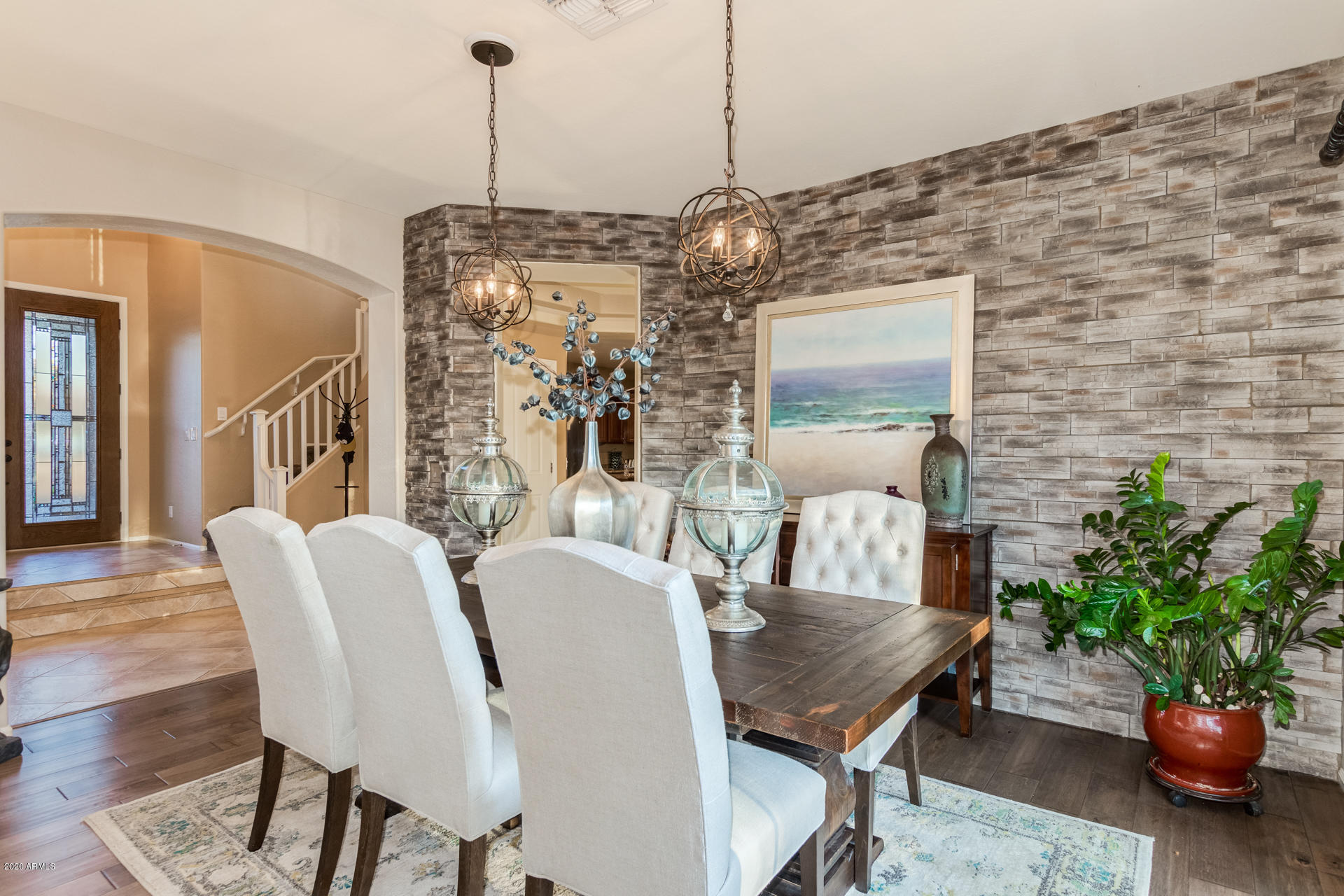 4549 East Ruffian Road Gilbert, AZ 85297 - Photo 8 of 52 a view of a dining room with furniture and wooden floor