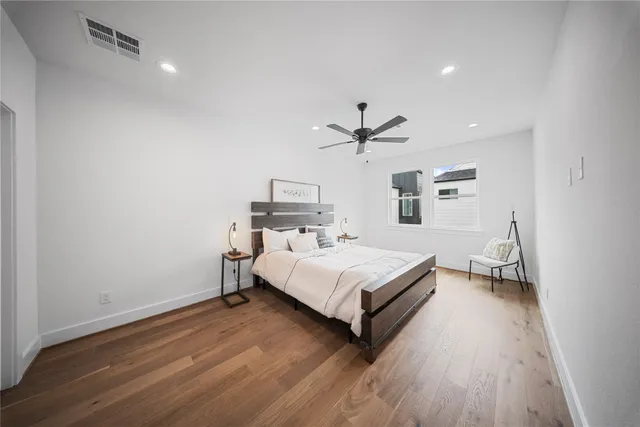 a room with a bed and a chandelier