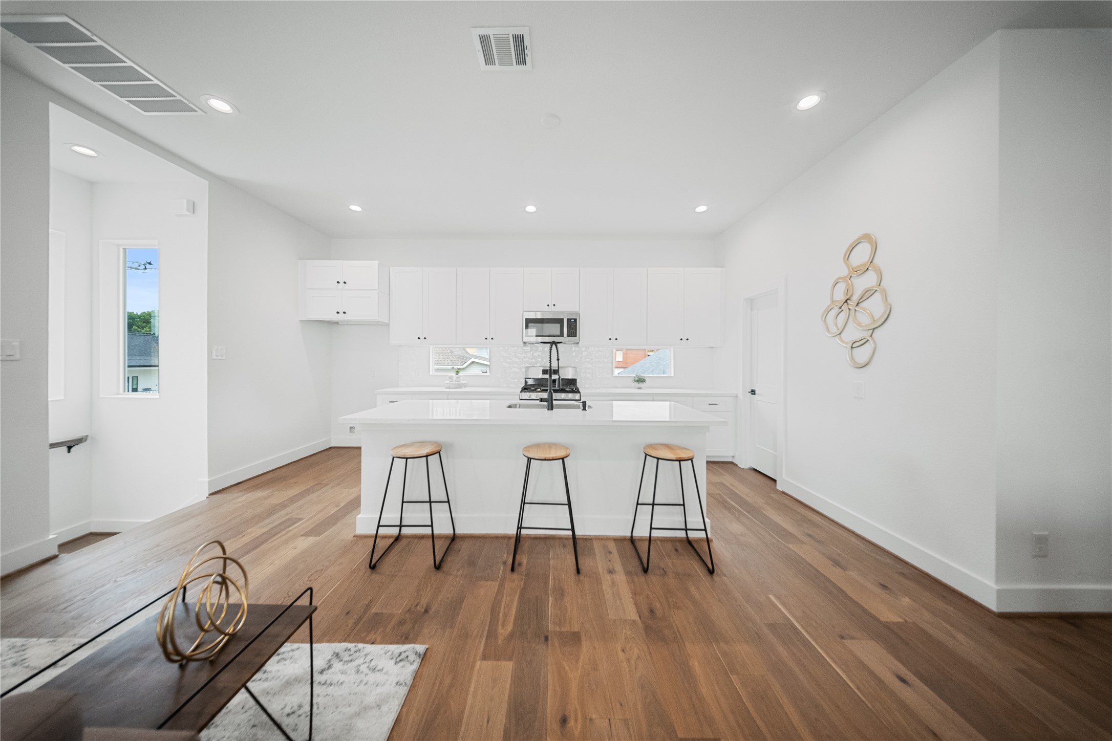 1122 Hogan Street Houston, TX 77009 - Photo 7 of 32 a view of a dining room with furniture and wooden floor