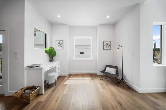 a room with furniture and a wooden floor