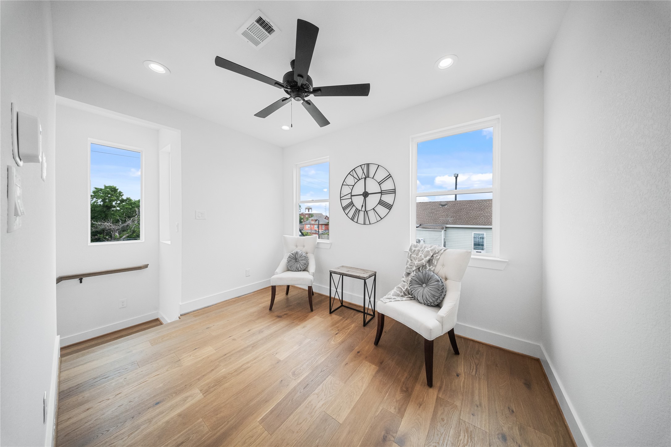 1122 Hogan Street Houston, TX 77009 - Photo 10 of 32 a living room with wooden floor and a window