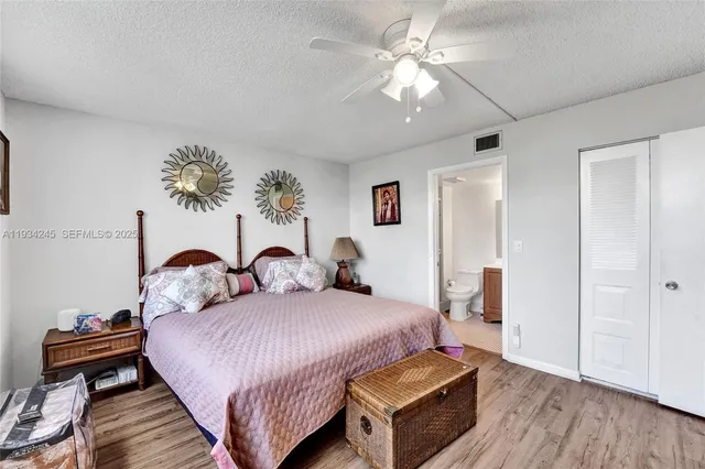 a bedroom with furniture and wooden floor