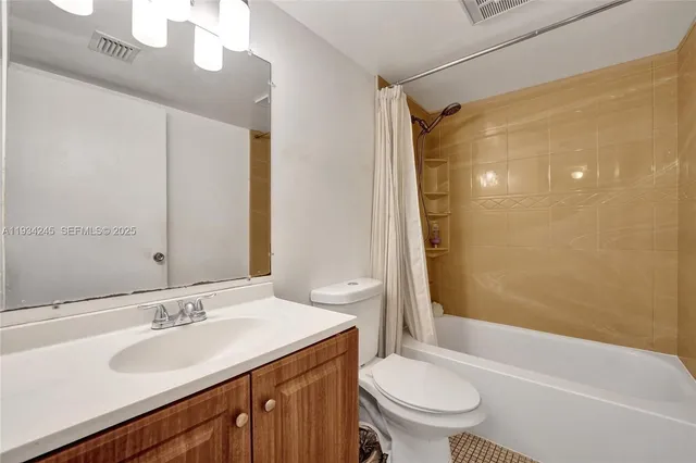 a view of storage and utility room with washer and dryer