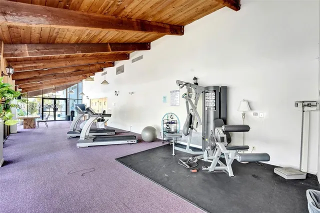 a view of a livingroom with furniture and staircase