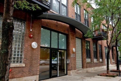 203 South Sangamon Street, Unit 310 Chicago, IL 60607 - Photo 1 of 16 a view of a brick house with a large windows