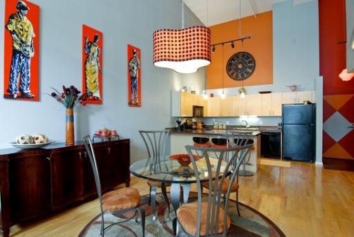203 South Sangamon Street, Unit 310 Chicago, IL 60607 - Photo 3 of 16 a view of a dining room with furniture and wooden floor