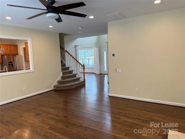 a view of an entryway with wooden floor