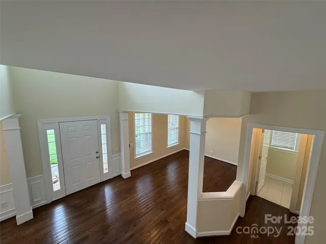 a view of entryway with wooden floor