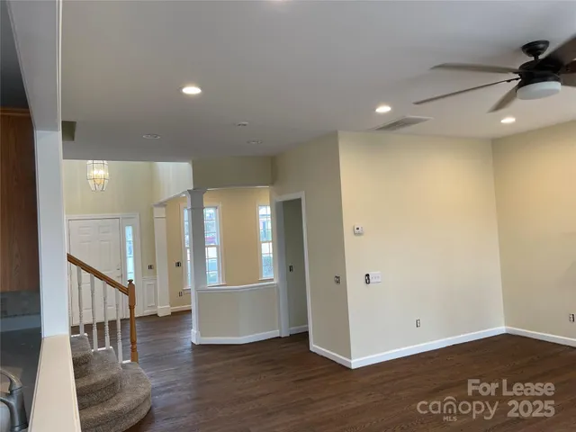 a view of an entryway with wooden floor