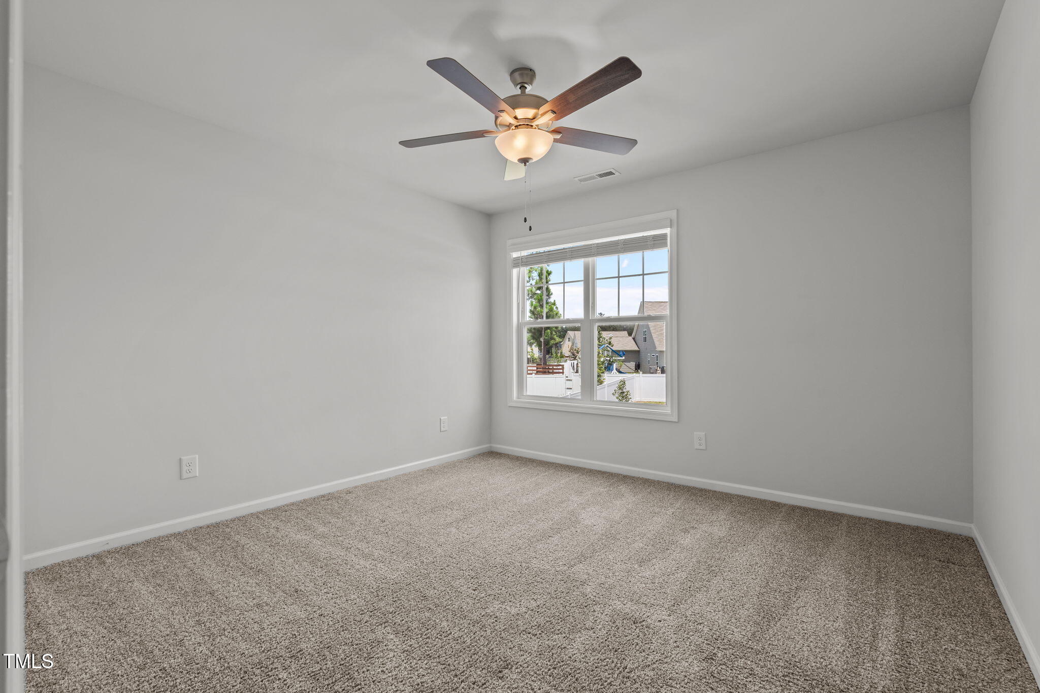 131 Sandy Springs Road Aberdeen, NC 28315 - Photo 40 of 61 an empty room with ceiling fan and window