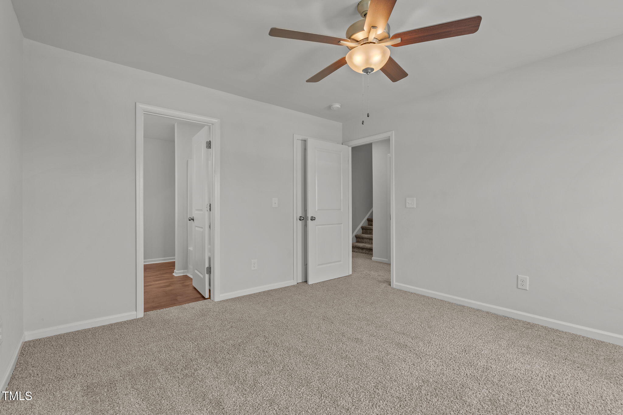 131 Sandy Springs Road Aberdeen, NC 28315 - Photo 43 of 61 an empty room with closet and a chandelier fan